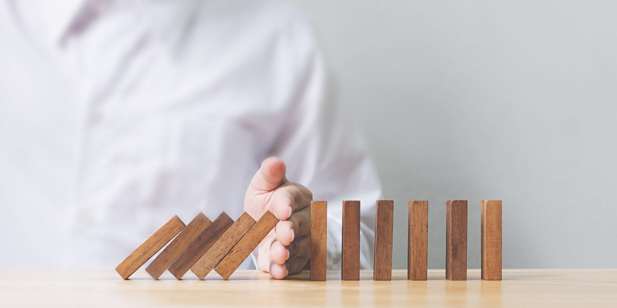 Hand stopping wooden domino business crisis effect or risk protection concept Schlagwort(e): risk, insurance, prevent, protect, block, business, crisis, effect, domino, solution, stop, solve, proactive, uncertainty, investment, stability, strategy, opportunity, danger, your, success, security, shield, care, careful, prudential, assessment, wood, concept, debt, finance, management, safety, defence, palladium, plan, leader, decision, customer, employee, benefit, profit, organization, economic, falling, balance, game, puzzle, conflict, intervention, risk, insurance, prevent, protect, block, business, crisis, effect, domino, solution, stop, solve, proactive, uncertainty, investment, stability, strategy, opportunity, danger, your, success, security, shield, care, careful, prudential, assessment, wood, concept, debt, finance, management, safety, defence, palladium, plan, leader, decision, customer, employee, benefit, profit, organization, economic, falling, balance, game, puzzle, conflict, intervention